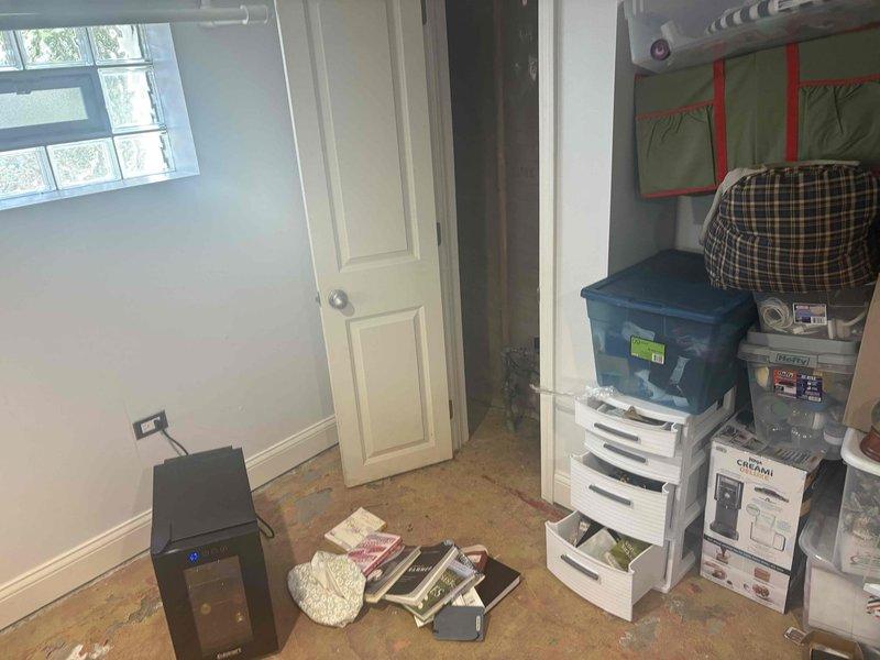 Conducted comprehensive site assessment of basement area to provide estimate for drain tile installation and additional sump pump system. Evaluated existing conditions including concrete floor deterioration, moisture indicators, and structural support elements. Documented current basement layout including storage areas and utility spaces to determine optimal routing for perimeter drain tile system and secondary sump pump placement. Assessed wall conditions, floor integrity, and drainage requirements necessary for complete waterproofing solution.