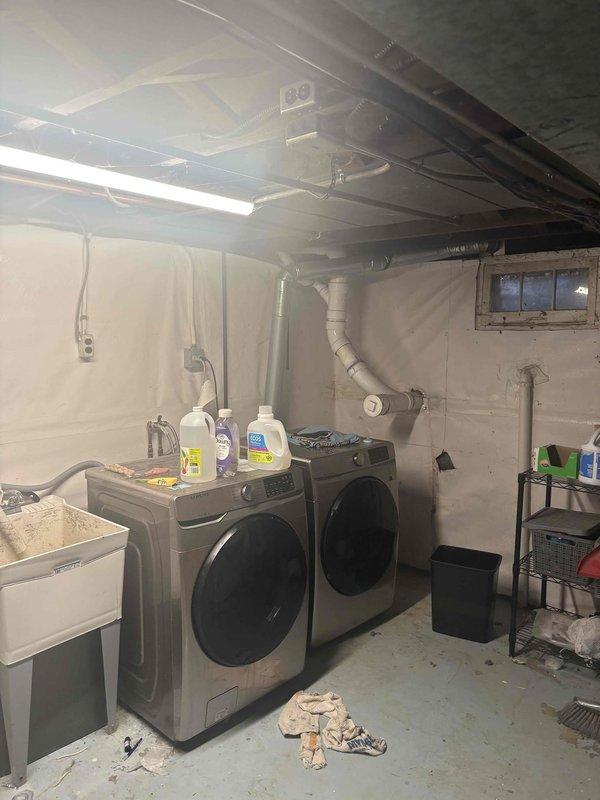 Conducted on-site consultation and assessment for new basement bathroom installation in a residential property over sixty years old. Evaluated existing plumbing infrastructure in basement laundry area, including current water supply lines, drainage systems, and waste piping configuration. Inspected exposed floor joists, existing PVC venting, and crawl space conditions to determine feasibility of tie-ins for proposed bathroom fixtures. Assessed structural limitations, available space for routing new supply and drain lines, and compatibility of aging plumbing system with modern bathroom requirements. Documented existing utility locations, including laundry hookups, utility sink connections, and mechanical systems to develop comprehensive scope of work. Photographed current conditions to support detailed estimate for all necessary plumbing work including water supply rough-in, drain-waste-vent system installation, and fixture connections required for complete bathroom addition.