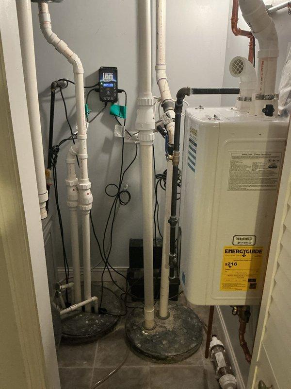 Responded to service call for sump pump battery backup system maintenance. Upon arrival, accessed utility room and performed comprehensive inspection of the sump pump assembly and backup power system. Examined all electrical connections, battery terminals, and control panel display to verify proper operation. Inspected PVC discharge piping, check valves, and drainage lines for blockages or deterioration. Tested battery backup system functionality and confirmed automatic switchover capability in the event of primary power failure. Verified float switch operation and pump cycling. Cleaned accumulated dust and debris from mechanical components and surrounding area. All systems tested and confirmed operational upon completion of service.