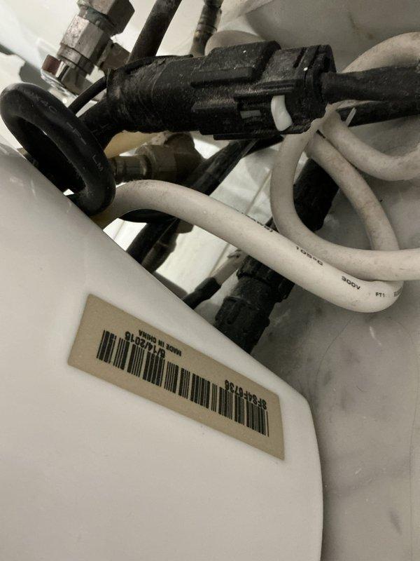 Responded to service call for malfunctioning Kohler smart toilet system displaying error code. Inspected electronic control panel and underlying plumbing connections, including water supply lines, valves, and fittings beneath the fixture. Diagnosed issue with the electronic bidet control module and verified all mechanical connections were secure and functioning properly.