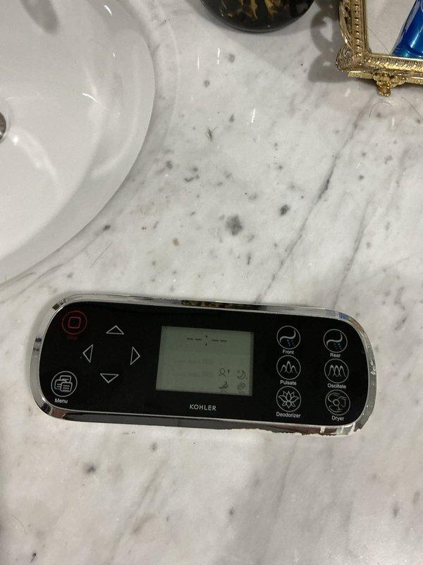 Responded to service call for malfunctioning Kohler smart toilet system displaying error code. Inspected electronic control panel and underlying plumbing connections, including water supply lines, valves, and fittings beneath the fixture. Diagnosed issue with the electronic bidet control module and verified all mechanical connections were secure and functioning properly.