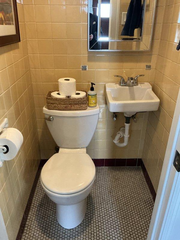 Completed installation of new vanity unit in residential bathroom. Installed white wall-mounted sink with chrome dual-handle faucet and connected PVC supply and drain lines. Toilet installation included proper sealing at base with wax ring, secure mounting to flange, and verification of proper flush operation and water supply connection. All fixtures tested for leaks and proper drainage, with final inspection confirming code-compliant installation and full functionality of plumbing system.