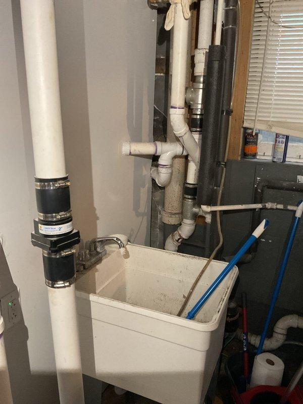 Responded to customer complaint of sewage odors and gurgling sounds from kitchen sink when ejector pump cycles. Upon inspection, identified issues with ejector pit system including deteriorated components and improper venting causing sewer gases to escape through plumbing fixtures. Documented existing conditions of ejector pump installation, associated piping network, and pit interior showing standing water and signs of system age. Provided detailed estimate for waste pump system repairs to resolve odor intrusion and restore proper operation.