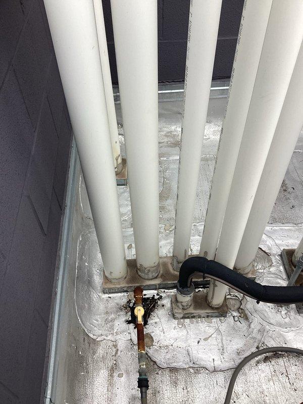 Completed plumbing estimate for new water line installation from 4th floor to rooftop mechanical area. Assessed existing utility room infrastructure including vertical PVC piping runs, AO Smith water heater with expansion tank, copper manifold system, and thermal insulation requirements. Documented routing path through multiple floor levels and mechanical room specifications for supply line installation.