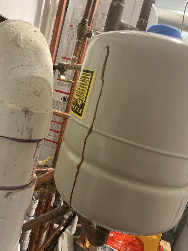 Responded to a water leak issue caused by a failing expansion tank on the water heater system. Upon inspection, confirmed the expansion tank had been leaking for approximately one week and required replacement. Successfully removed the defective expansion tank and installed a new replacement unit from available stock inventory. Verified all connections were properly sealed, tested the system for leaks, and confirmed proper operation of the water heater and associated plumbing components. The new expansion tank was securely mounted and integrated with the existing copper piping and valve assembly to restore full system functionality.