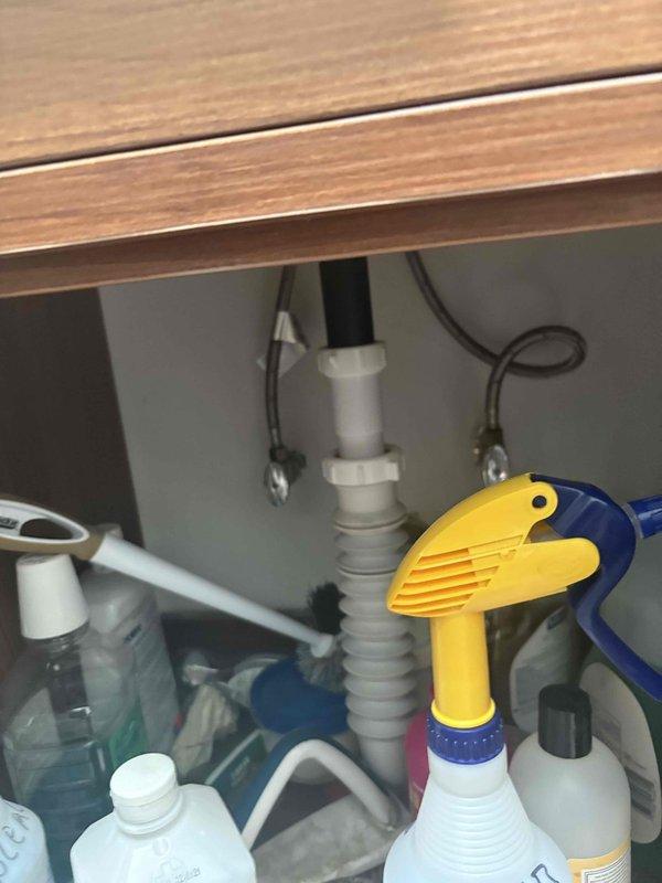Conducted comprehensive assessment of existing plumbing infrastructure to provide estimate for complete galvanized pipe replacement throughout the property. Evaluated exposed galvanized water supply lines within wall cavities, documenting deterioration and corrosion levels requiring full system upgrade. Assessed requirements for water heater replacement and associated gas line relocation to accommodate new equipment placement and meet current code requirements. Documented existing plumbing configuration including drain assemblies, supply lines, and venting systems to develop accurate scope of work for complete repiping project.
