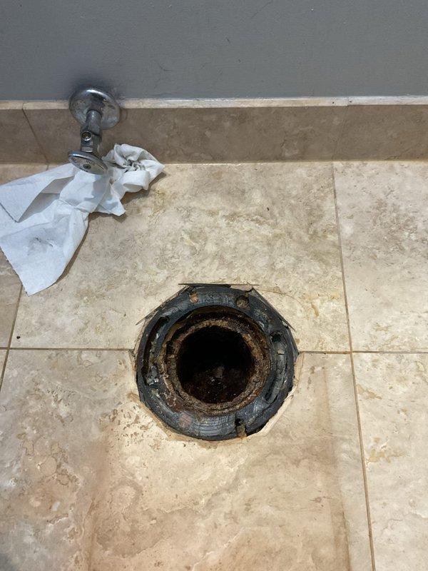 Diagnosed and sold toilet flange replacement due to severe rust and corrosion observed at the base of the toilet. Customer approved repair to replace deteriorated flange and ensure proper toilet seal and stability to prevent future leaks and potential water damage.