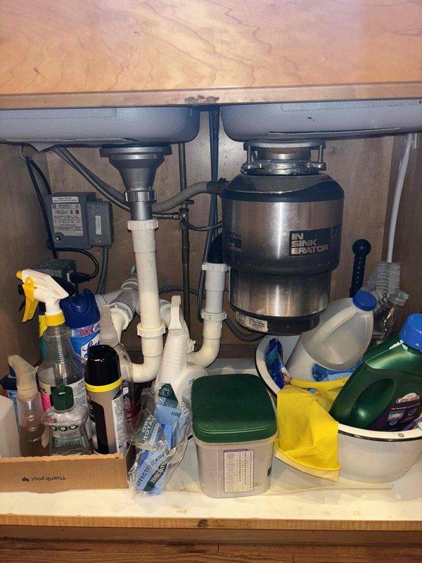 Completed comprehensive VIP plumbing maintenance inspection of residential property. Performed thorough evaluation of Bradford White water heater unit in basement mechanical room, verifying proper operation of all valves, connections, and safety mechanisms, and inspected ductwork ventilation system. Examined kitchen double-sink plumbing configuration including garbage disposal unit, drain assemblies, PVC piping connections, and electrical components to ensure all systems were functioning correctly with no leaks or operational issues detected.