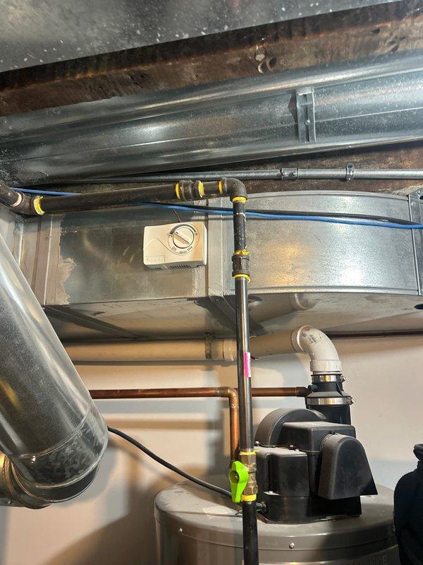 Completed plumbing estimate for water heater replacement in mechanical room. Assessed existing water heater installation, surrounding copper supply lines, galvanized ductwork connections, and associated shut-off valves. Documented current configuration including pipe routing, electrical connections, and clearance requirements for future water heater installation.