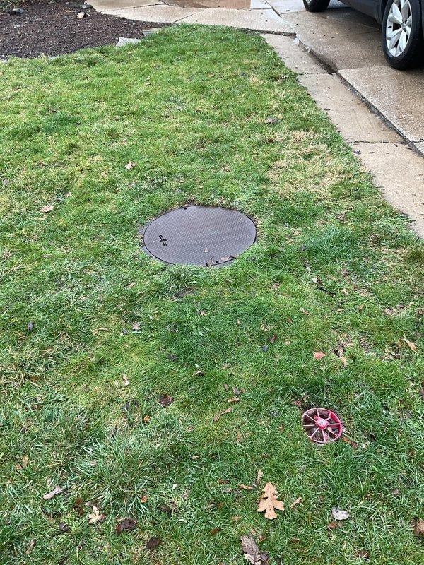 Completed installation of waste pump system with associated discharge piping and venting. Installed exterior utility access cover in lawn area for pump access and maintenance, and ran PVC discharge and vent lines through basement area connecting to existing plumbing infrastructure. System tested and operational upon completion.