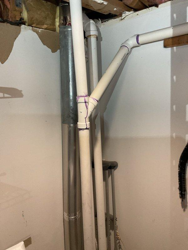 Completed installation of waste pump system with associated discharge piping and venting. Installed exterior utility access cover in lawn area for pump access and maintenance, and ran PVC discharge and vent lines through basement area connecting to existing plumbing infrastructure. System tested and operational upon completion.