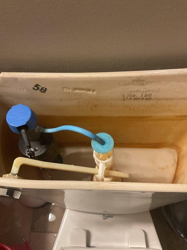 Responded to service call for slow-filling toilet in guest bathroom and water heater flush. Inspected toilet tank and identified restricted water flow through fill valve assembly. Adjusted fill valve and cleared mineral deposits affecting flow rate, restoring proper tank filling speed. Performed routine maintenance flush on water heater to remove sediment buildup and ensure optimal heating efficiency. Verified all plumbing components functioning correctly before completing service.