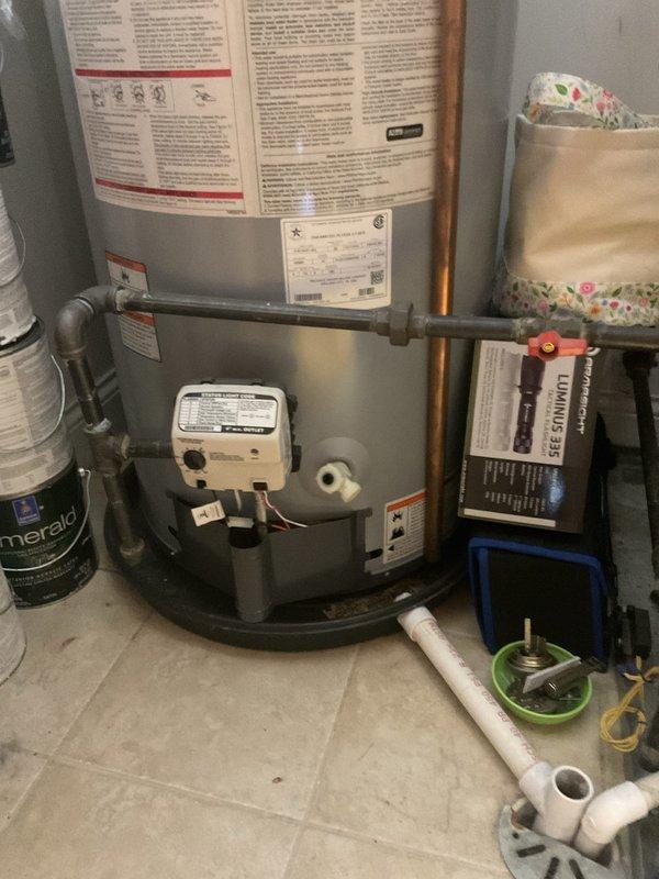 Responded to service call for slow-filling toilet in guest bathroom and water heater flush. Inspected toilet tank and identified restricted water flow through fill valve assembly. Adjusted fill valve and cleared mineral deposits affecting flow rate, restoring proper tank filling speed. Performed routine maintenance flush on water heater to remove sediment buildup and ensure optimal heating efficiency. Verified all plumbing components functioning correctly before completing service.