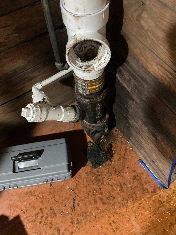 Completed tankless water heater installation including necessary piping modifications with 42", 24", and 48" nipples, 1"x3/4" tee, and 3/4"x1/2" reducers. Installed required gas and water supply connections in crawl space area, addressing existing pipe deterioration and ensuring proper venting through PVC drainage system. All connections secured with appropriate clamps and fittings, system tested and operational.