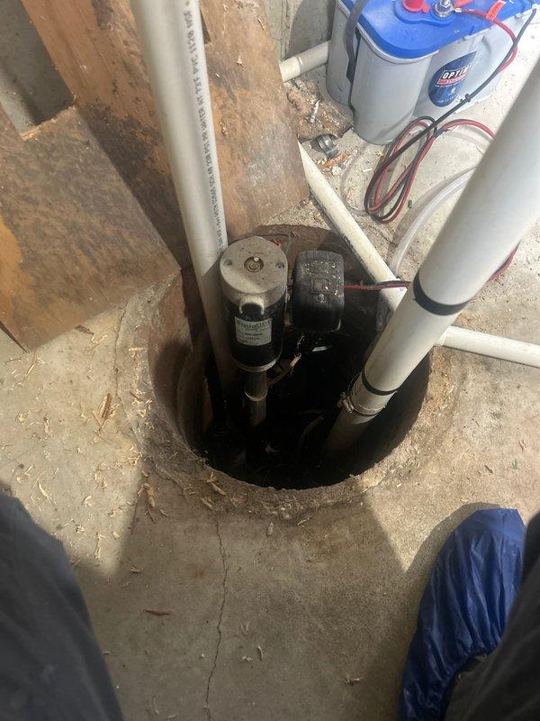 Responded to service call for sump pump producing abnormal noise over previous weeks. Performed comprehensive inspection of sump pump system and associated components including discharge piping, check valve, and electrical connections. Upon examination, pump remained operational with proper cycling function. Inspected motor housing, float switch mechanism, and impeller assembly for wear or debris accumulation. Evaluated water filtration system and pressure tank connections in proximity to sump installation. Documented current condition of all equipment with photographic evidence showing pump assembly, PVC discharge lines, and electrical control box. Verified proper operation and advised on system status, confirming no immediate component replacement required at this time.