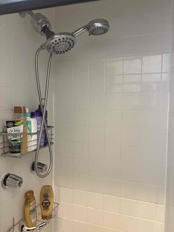 Responded to service call for cracked shower pan in upstairs bathroom. Upon inspection, confirmed damage to existing shower pan requiring full replacement. Removed shower fixtures and accessories, demolished damaged pan, and prepared substrate for new installation. Installed new shower pan with proper waterproofing and slope for drainage, reconnected plumbing fixtures including dual showerhead system and tub spout, and verified all connections were secure and leak-free before completing the job.