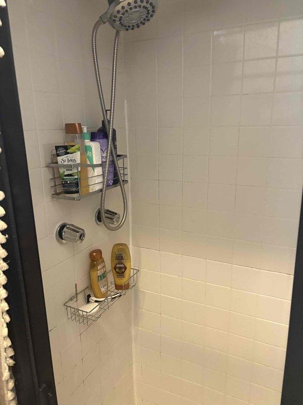 Responded to service call for cracked shower pan in upstairs bathroom. Upon inspection, confirmed damage to existing shower pan requiring full replacement. Removed shower fixtures and accessories, demolished damaged pan, and prepared substrate for new installation. Installed new shower pan with proper waterproofing and slope for drainage, reconnected plumbing fixtures including dual showerhead system and tub spout, and verified all connections were secure and leak-free before completing the job.