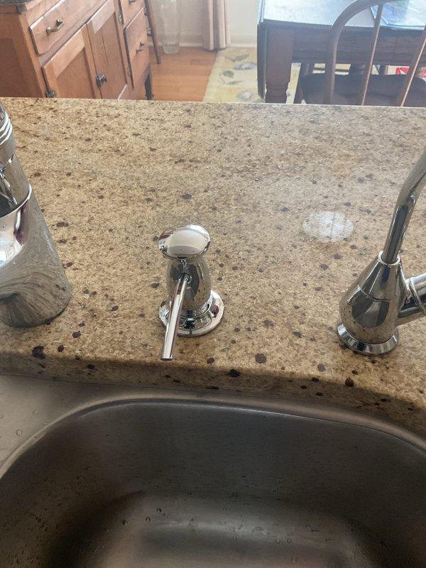 Responded to a garbage disposal malfunction in a residential kitchen that had been inoperative for five days. Upon arrival, inspected the undermount stainless steel sink installation with granite countertop and assessed the disposal unit's electrical and mechanical connections. Diagnosed the issue by examining the disposal's mounting assembly, reset mechanism, and electrical supply beneath the sink cabinet. Cleared a jam in the grinding chamber, reset the thermal overload protection switch, and verified proper operation of the flywheel and impeller assembly. Tested the unit under running water to confirm proper drainage and grinding function. All plumbing connections remained secure with no leaks detected. Disposal restored to full operational capacity.