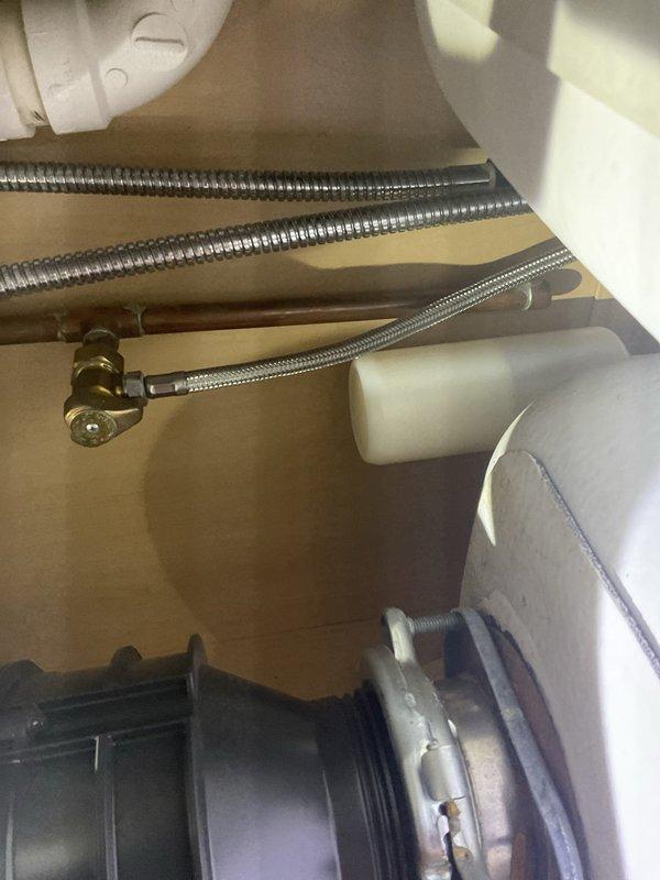 Responded to a garbage disposal malfunction in a residential kitchen that had been inoperative for five days. Upon arrival, inspected the undermount stainless steel sink installation with granite countertop and assessed the disposal unit's electrical and mechanical connections. Diagnosed the issue by examining the disposal's mounting assembly, reset mechanism, and electrical supply beneath the sink cabinet. Cleared a jam in the grinding chamber, reset the thermal overload protection switch, and verified proper operation of the flywheel and impeller assembly. Tested the unit under running water to confirm proper drainage and grinding function. All plumbing connections remained secure with no leaks detected. Disposal restored to full operational capacity.