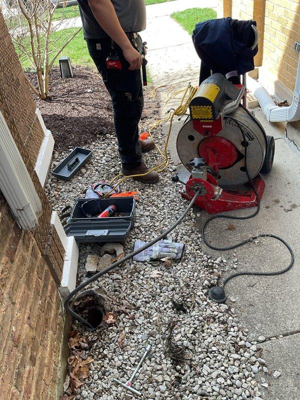 Completed same-day emergency rodding service to clear drainage obstruction. Accessed system through exterior catch basin and interior cleanout point to effectively remove blockage and restore proper water flow. Exterior catch basin showed significant deterioration with heavy rust staining on metal components and extensive concrete cracking around the access point, with standing water present prior to service. Successfully cleared the line using professional rodding equipment, working from both access points to ensure complete removal of obstruction. System tested and confirmed to be draining properly upon completion of service.