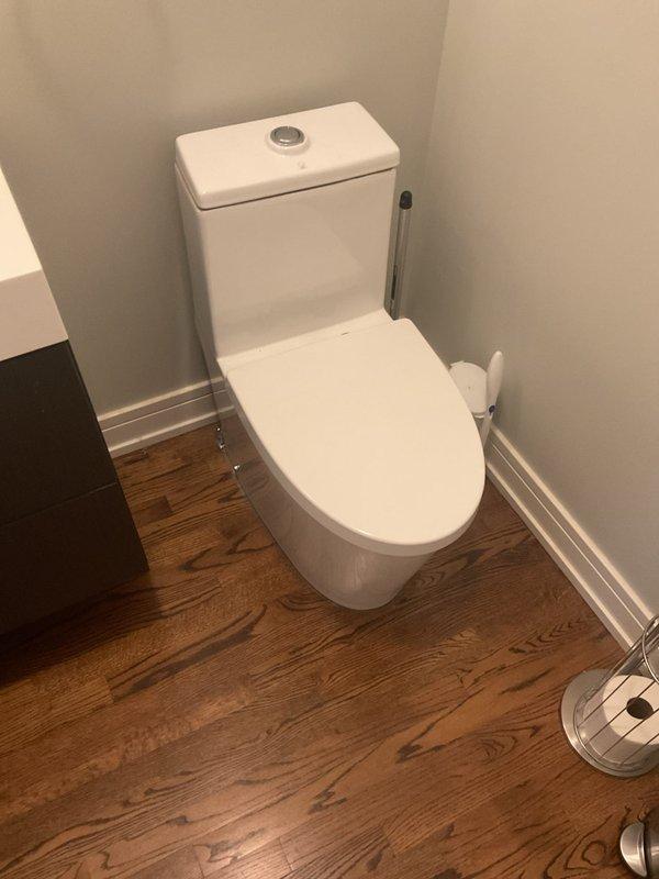 Removed and replaced two existing toilets with customer-supplied units in separate bathroom locations. Both installations involved disconnecting old fixtures, removing wax rings, inspecting and cleaning flange connections, and installing new two-piece toilets with dual-flush mechanisms. Ensured proper sealing with new wax rings, secured mounting bolts, connected water supply lines, and tested for leaks and proper flush operation. All fixtures are functioning correctly with no visible leaks detected.
