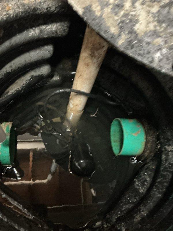 Completed VIP maintenance inspection and assessment of flood control system including sump pump assembly and associated plumbing components. Documented existing equipment condition including primary pump unit with backup system, discharge piping, copper water lines, and mechanical connections for estimate preparation.