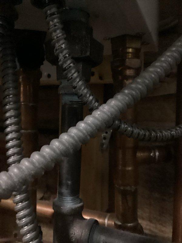 Responded to no hot water call and diagnosed Navien tankless water heater displaying error code E803. Inspected unit and associated plumbing connections including copper supply lines, flexible metallic hoses, and shut-off valves. Troubleshot igniter failure on system and resolved error code issue. Verified proper operation of unit, confirmed hot water restoration, and ensured all connections were secure with no leaks present.