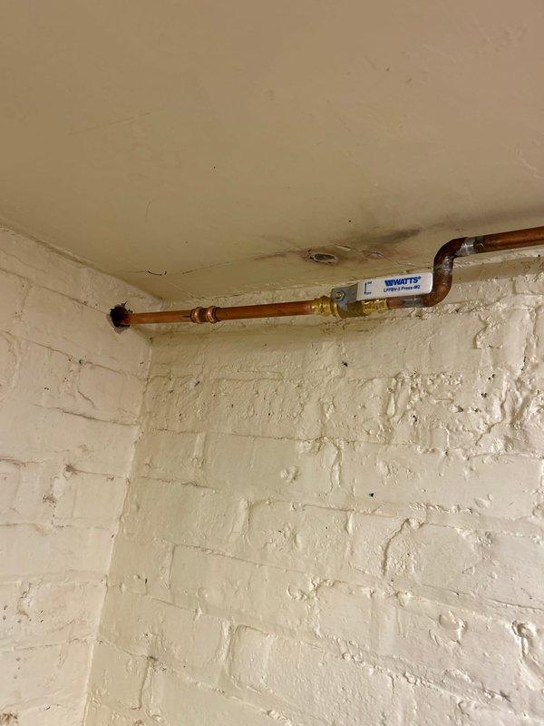 Replaced exterior hose spigot with new frost-free sillcock assembly. Installed copper supply line from interior shutoff valve through exterior wall, including Watts pressure regulator and brass shutoff valve for system protection. All connections soldered and tested for proper operation and leak-free performance.
