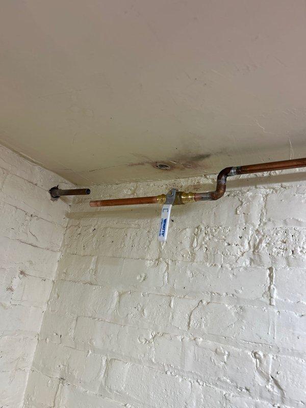 Replaced exterior hose spigot with new frost-free sillcock assembly. Installed copper supply line from interior shutoff valve through exterior wall, including Watts pressure regulator and brass shutoff valve for system protection. All connections soldered and tested for proper operation and leak-free performance.