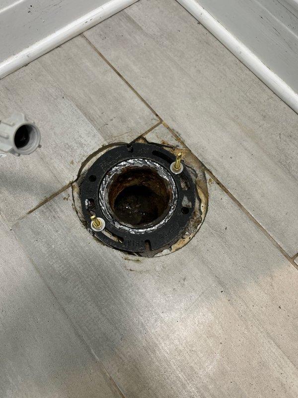 Removed and replaced severely corroded toilet flange that had deteriorated beyond serviceability. The existing flange exhibited extensive rust damage and compromised structural integrity, requiring complete removal. Installed new flange assembly with proper sealing to ensure watertight connection to the drain pipe. Secured mounting hardware and verified proper alignment for toilet installation.