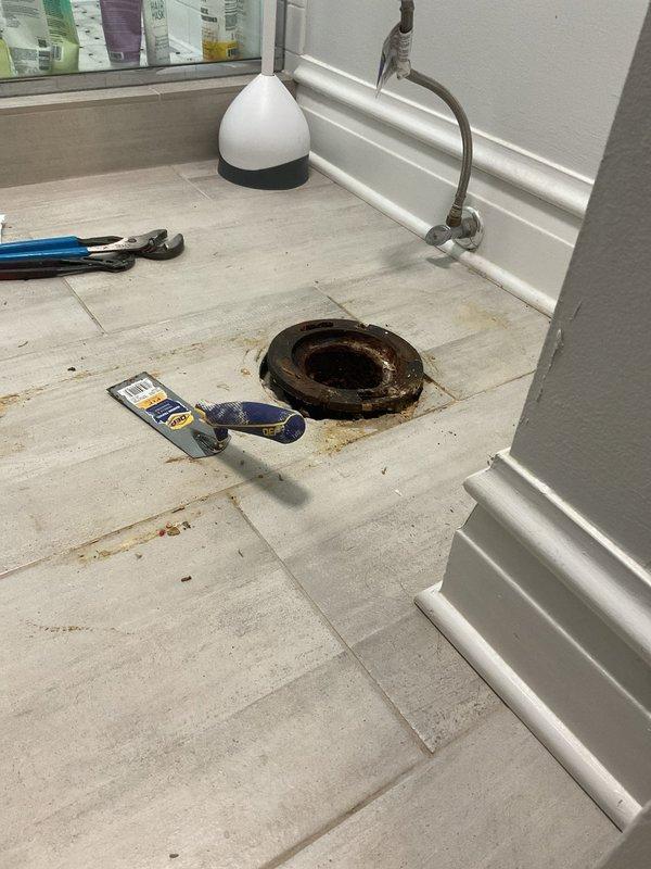 Removed and replaced severely corroded toilet flange that had deteriorated beyond serviceability. The existing flange exhibited extensive rust damage and compromised structural integrity, requiring complete removal. Installed new flange assembly with proper sealing to ensure watertight connection to the drain pipe. Secured mounting hardware and verified proper alignment for toilet installation.
