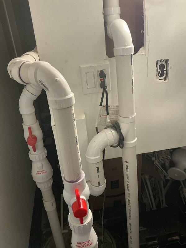 Performed annual preventive maintenance on tanked water heater located in basement of nine-year-old residential property. Executed complete tank flush procedure by connecting drain hose to tank drain valve, draining sediment-laden water into collection bucket until discharge ran clear. Inspected plumbing connections, ball valves, and PVC piping system for proper operation and potential leaks. No issues or deficiencies identified during service; unit operating within normal parameters.
