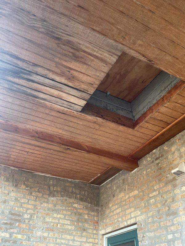 Responded to water leak investigation in basement area. Upon arrival, conducted thorough inspection of basement ceiling structure, exposed joists, and adjacent utility spaces to locate source of ongoing water infiltration. Examined wooden ceiling panels, brick wall junctions, and accessible crawl space areas where moisture damage was reported. Inspected exposed plumbing lines, ductwork penetrations, and support column areas for signs of active leaking or water staining. Documented findings with photographic evidence showing ceiling access points and basement mechanical room configuration to assist in determining leak origin and recommend appropriate repair solutions.