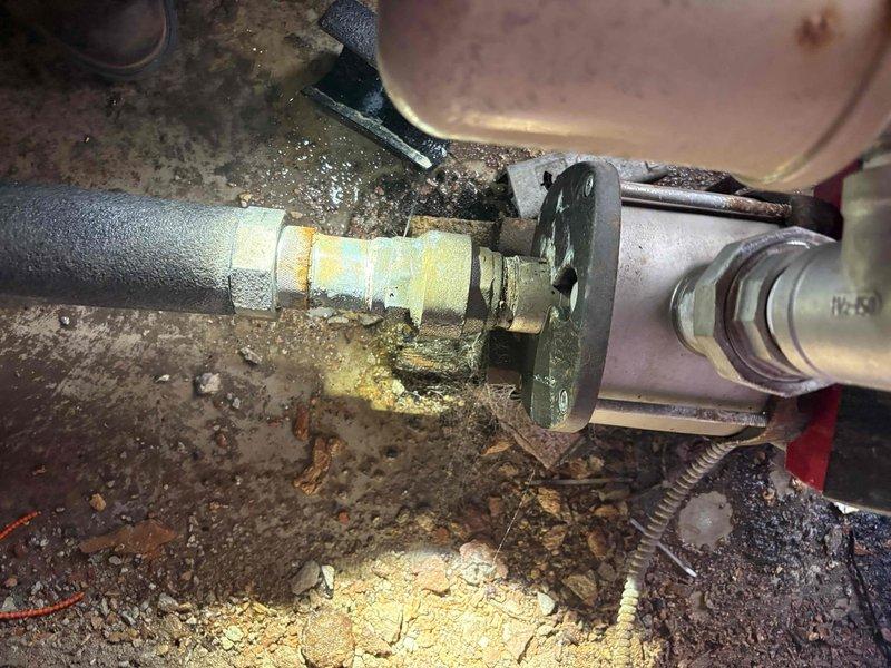 Responded to service call for leaking pipe located under front stairs. Upon inspection, identified corroded copper piping in utility area with visible water damage on floor surfaces and deteriorated pipe insulation. Assessed plumbing system including circulator pump, brass fittings, and associated copper supply lines showing significant age-related corrosion and weathering. Documented existing conditions including compromised foam insulation, corroded mounting hardware, and moisture infiltration in mechanical space. Provided comprehensive estimate for pipe repair and replacement of affected components to resolve active leak and prevent further water damage.