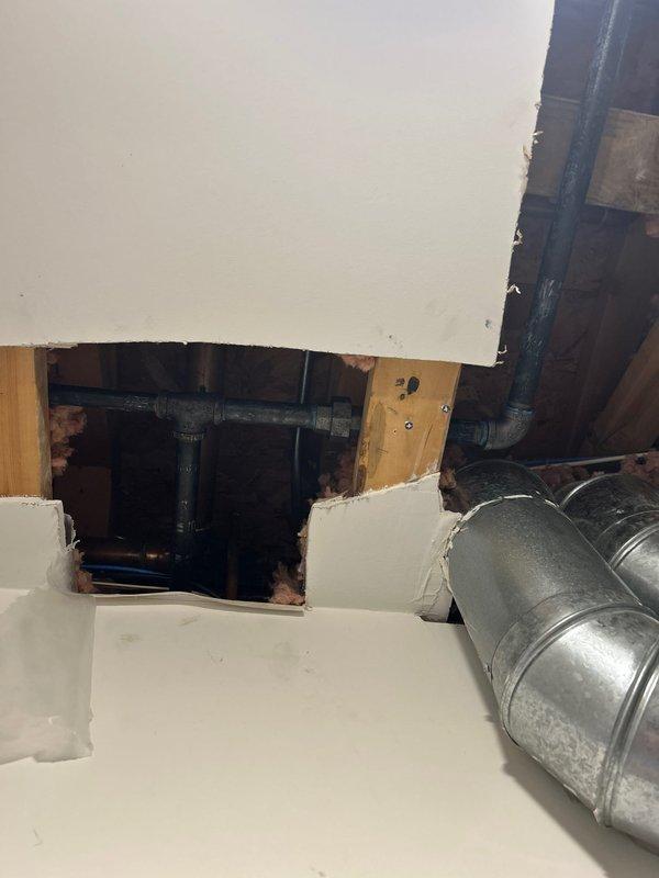 Successfully completed a comprehensive gas piping repipe for Unit 4. Accessed the existing gas line system through the attic space, requiring the creation of access points through drywall and ceiling materials to reach the gas piping infrastructure. Removed and replaced all compromised galvanized gas piping with new code-compliant materials throughout the unit. Work involved coordination around existing HVAC ductwork and insulation materials in the attic crawl space. All connections were properly fitted, tested for leaks, and verified for safe operation per current plumbing codes and manufacturer specifications.