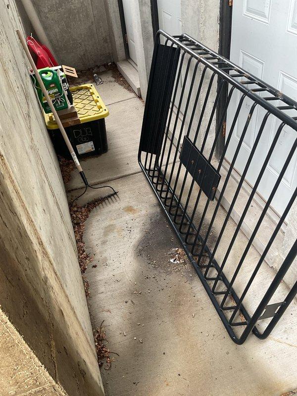 Conducted site assessment of exterior drainage system at commercial condominium building to provide rodding estimate for 3-4 floor drains experiencing blockages from accumulated leaves and debris. Inspected stairwell landing drain and corridor drainage points, documenting conditions including visible organic matter buildup, water staining on concrete surfaces, and drainage infrastructure requiring mechanical cleaning to restore proper flow capacity.