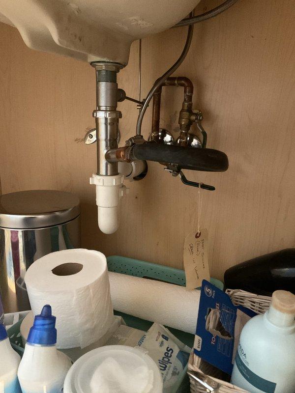 Responded to service call for non-functioning outdoor faucet. Upon inspection, traced water supply lines from exterior spigot through interior plumbing system. Located shutoff valve in mechanical room serving outdoor hose bibb and confirmed valve was in closed position, preventing water flow to exterior fixture. Opened shutoff valve to restore water supply to outdoor faucet and verified proper operation with no leaks detected at connection points or valve assembly.