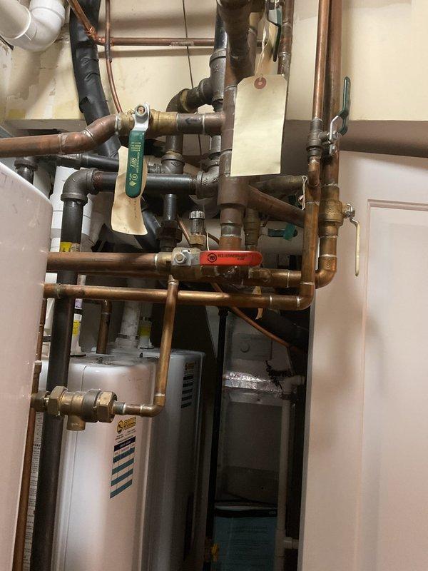 Responded to service call for non-functioning outdoor faucet. Upon inspection, traced water supply lines from exterior spigot through interior plumbing system. Located shutoff valve in mechanical room serving outdoor hose bibb and confirmed valve was in closed position, preventing water flow to exterior fixture. Opened shutoff valve to restore water supply to outdoor faucet and verified proper operation with no leaks detected at connection points or valve assembly.