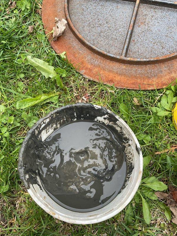 Completed comprehensive flood control and sump pump system inspection as requested. Accessed and inspected the concrete sump basin, which contained three check valve discharge points with accumulated sediment and standing water. Cleaned and evaluated the pit condition, noting mineral deposits and water exposure on concrete surfaces. Removed debris and sediment buildup from the basin floor to ensure proper drainage function. All check valves and discharge fittings were examined for proper operation and positioning within the system.