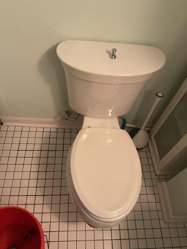 Responded to a toilet leaking at the base in a 140-year-old residential property. Upon inspection, identified compromised wax ring seal between the toilet bowl and floor flange as the source of the ongoing leak. Removed toilet, replaced deteriorated wax ring with new seal, inspected flange for damage, reinstalled toilet with proper bolting and alignment, and tested for leaks to confirm repair was successful.