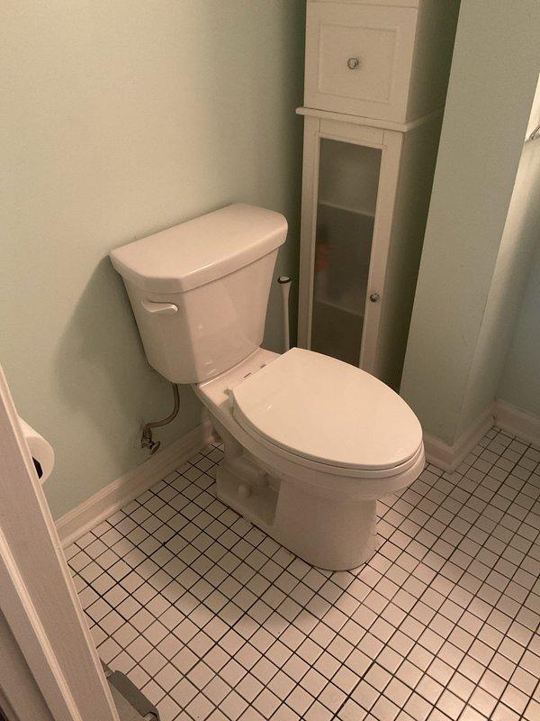 Responded to a toilet leaking at the base in a 140-year-old residential property. Upon inspection, identified compromised wax ring seal between the toilet bowl and floor flange as the source of the ongoing leak. Removed toilet, replaced deteriorated wax ring with new seal, inspected flange for damage, reinstalled toilet with proper bolting and alignment, and tested for leaks to confirm repair was successful.