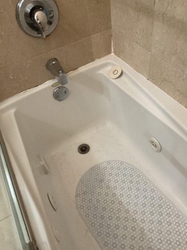 Responded to service call for slow-draining bathtub and bathroom sink. Cleared drainage obstructions from both fixtures, restoring proper water flow and drainage speed. Assessed bathtub drain assembly which was missing a stopper mechanism and provided recommendations for installing a new tub drain stopper to allow the bathtub to retain water as requested.