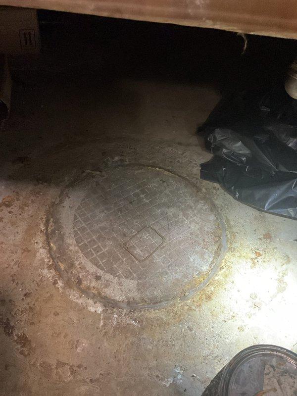 Performed routine maintenance cleaning and rodding of the main sewer line and catch basin system for a multi-unit residential building. Accessed the sewer system through the crawl space entry point and removed accumulated debris and buildup from the line to restore proper drainage flow. All waste lines were successfully cleared and tested for proper operation.