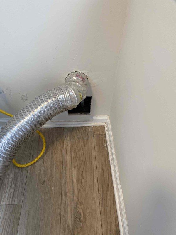 Responded to service call for water leak occurring at interior plumbing connection when outdoor spigot was activated. Upon inspection, identified leak at wall penetration point where supply line transitions from interior to exterior. Accessed leak location through interior wall opening, repaired faulty connection at pipe junction, and verified proper seal at wall penetration. Tested outdoor spigot assembly with Y-connector attachment under full water pressure to confirm leak was eliminated and all connections remained dry during operation.