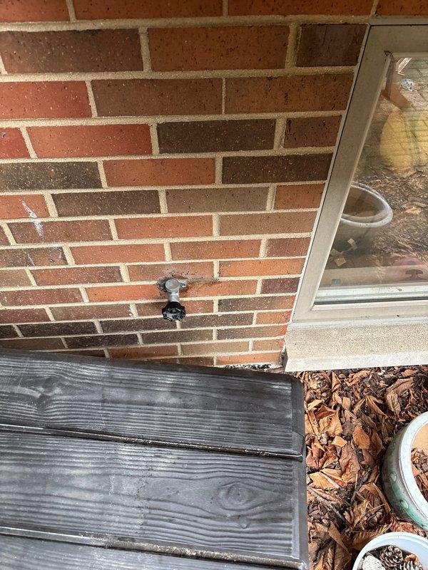Responded to service call for leaking exterior hose bib at commercial property. Upon arrival, conducted thorough inspection of the affected spigot mounted on brick exterior wall near deck area. Assessed water damage potential and documented current condition with photographs. Provided detailed estimate for hose bib repair or replacement, including evaluation of internal valve components, connection points, and potential wall penetration issues that may be contributing to the leak. Recommended appropriate repair solutions based on severity of wear and age of existing fixture.