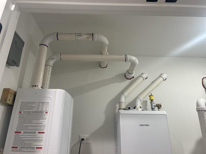 Conducted on-site evaluation of existing sump pump system consisting of two Zoeller pumps (Model M264 0.4HP and Model M63 0.3HP) to assess feasibility and requirements for battery backup installation. Inspected mechanical room containing multiple plumbing systems, including Navien tankless water heater, water heater unit, radiant heating manifold with circulation pump, expansion tanks, and extensive PVC and copper piping infrastructure. Evaluated electrical connections, pump configurations, and available space for battery backup system integration. Provided estimate for battery backup unit supply and professional installation to ensure continued sump pump operation during power outages, maintaining basement flood protection capabilities.