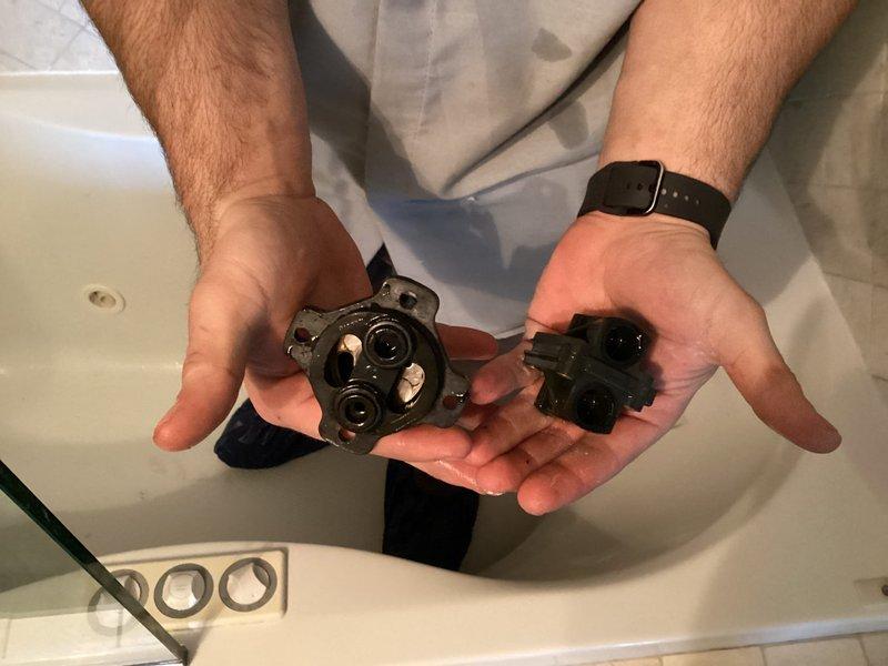 Replaced defective bathtub diverter valve assembly and cartridge in residential bathroom. Building water supply was shut down from 9AM-1PM to facilitate safe removal and installation of plumbing components, ensuring no water damage or service interruption to occupied units during the repair.