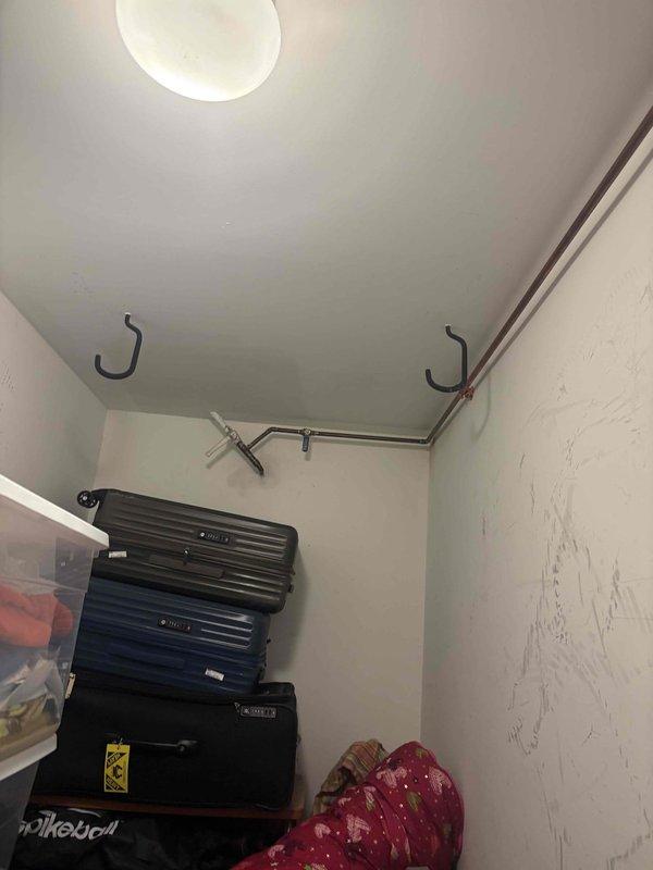 Completed plumbing estimate for bathroom renovation project involving toilet and bathtub area. Assessed existing copper piping connections and evaluated wall framing exposure where significant demolition work had occurred, documenting conditions for piping replacement or modification scope.