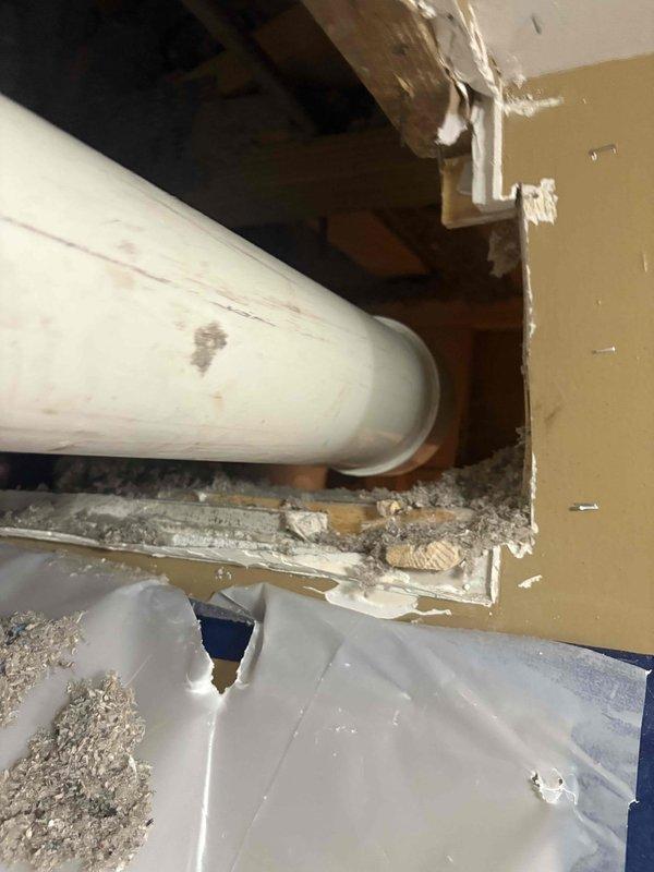 Completed plumbing estimate for bathroom renovation project involving toilet and bathtub area. Assessed existing copper piping connections and evaluated wall framing exposure where significant demolition work had occurred, documenting conditions for piping replacement or modification scope.