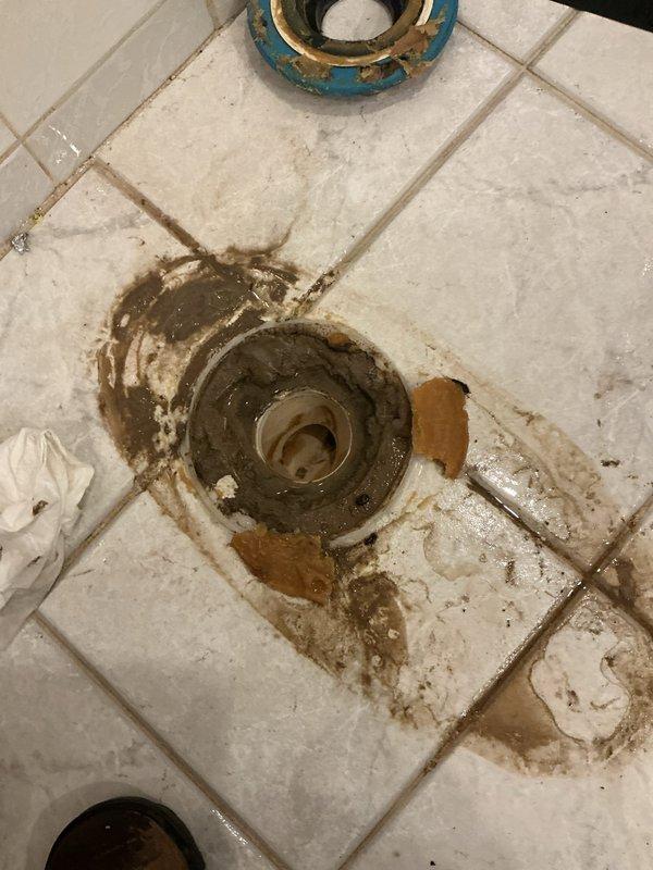Responded to a basement backup issue caused by heavy rainfall. Upon inspection, accessed the main sewer line through an underground cleanout chamber, which exhibited significant corrosion and aging. Performed thorough camera inspection and clearing of the line to restore proper drainage. Additionally, inspected and addressed a secondary drainage point at a floor drain location showing extensive water damage, mineral deposits, and deterioration around the fixture. Cleared blockages, verified proper flow through both access points, and confirmed the drainage system was functioning correctly to prevent future backup incidents during rain events.